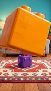Bunte Kunststoffbausteine im Kinderzimmer auf Teppich.